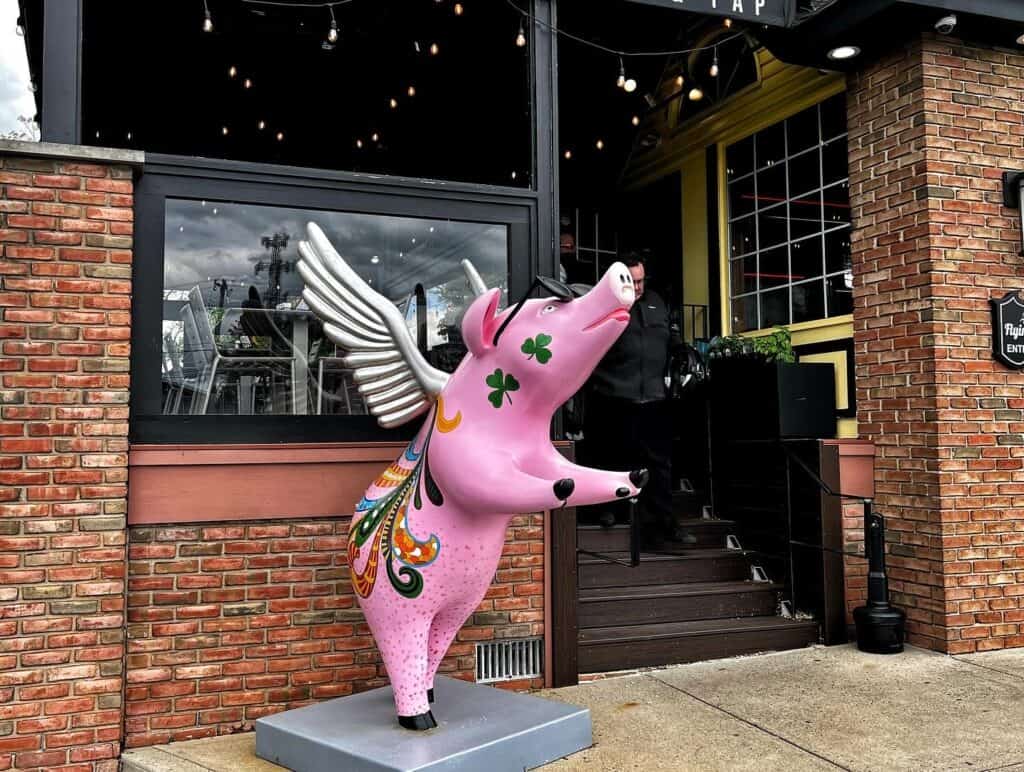 The whimsical flying pig statue outside the Flying Pig Tavern in Limerick, PA
